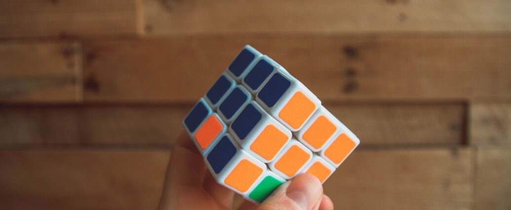 person holding 3x3 Rubik's Cube