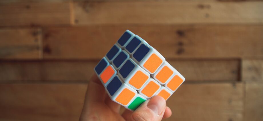 person holding 3x3 Rubik's Cube