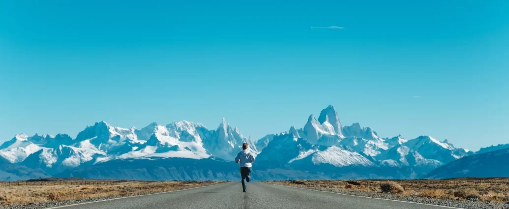 person running on road at daytime